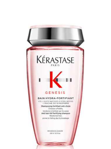 Roséfarbene Flasche mit silberfarbenem Deckel, Produktname „Kérastase Genesis Bain Hydra-Fortifiant